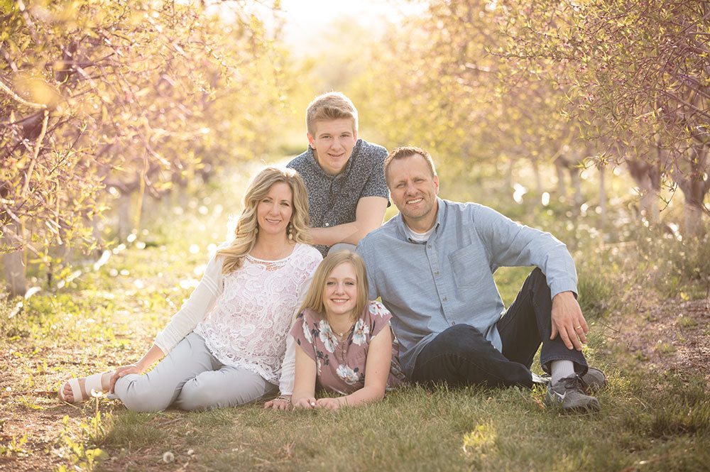 family in peach orchard