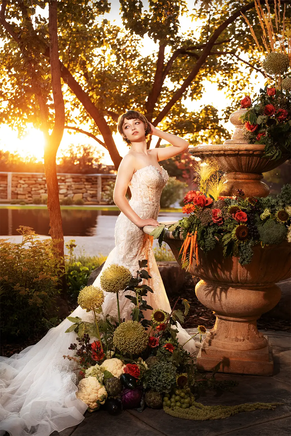 Sunset bridal portrait of a bride posing near a water fountain by Ogden Utah wedding photographer Masterpiece Images